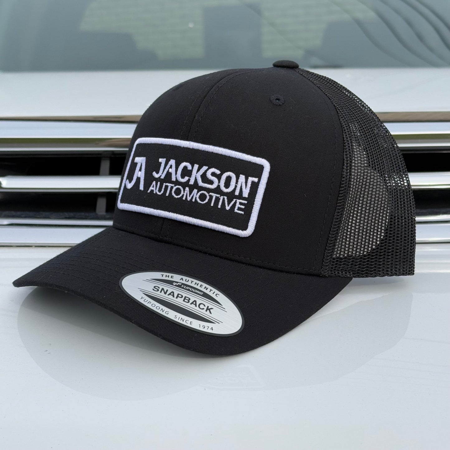 JA Black Embroidered Snapback Trucker Hat