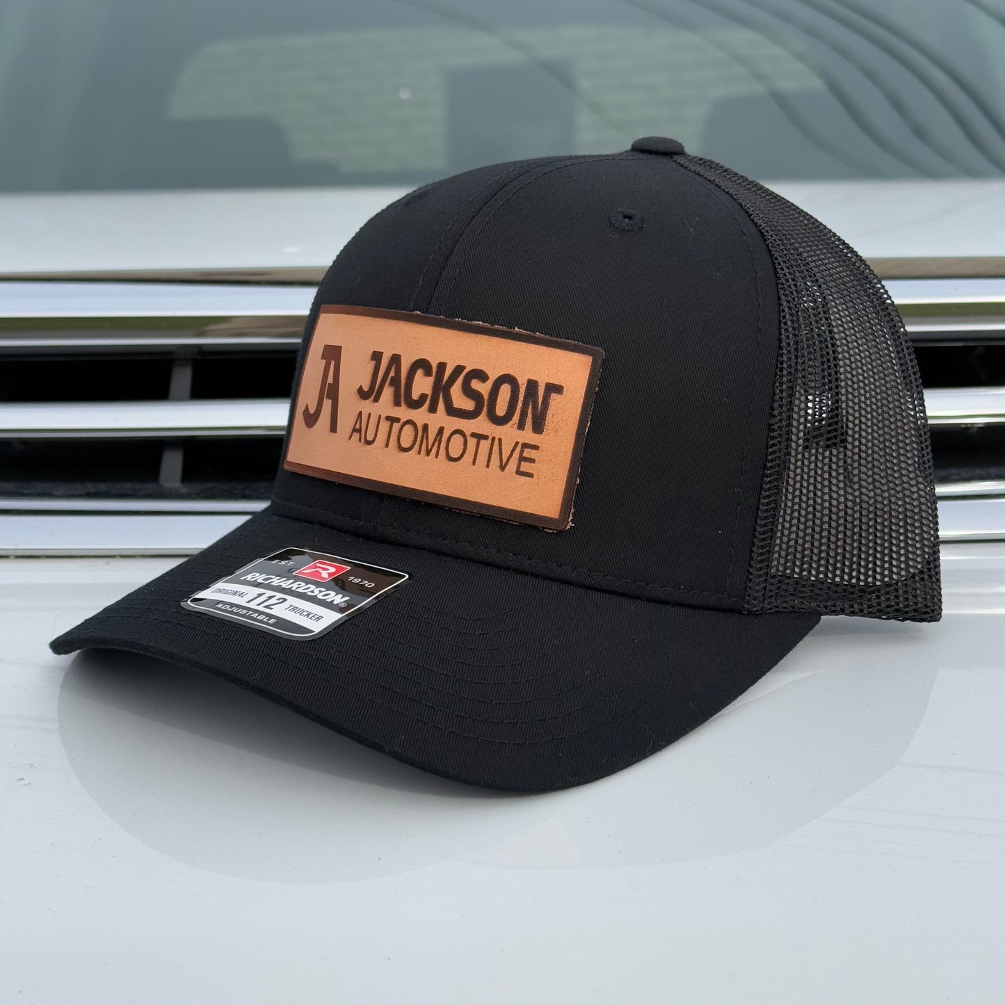 JA Leather Patch Snapback Trucker Hat