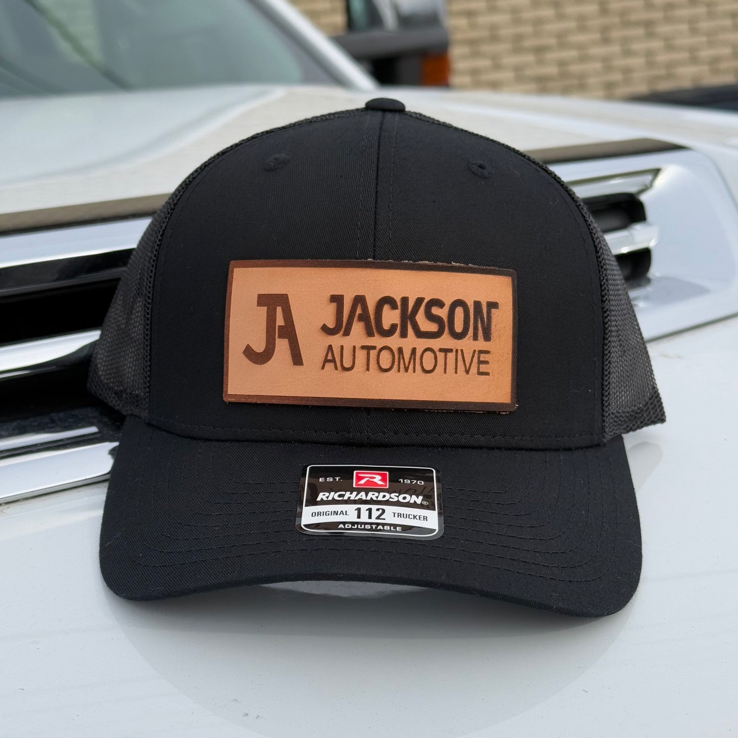 JA Leather Patch Snapback Trucker Hat