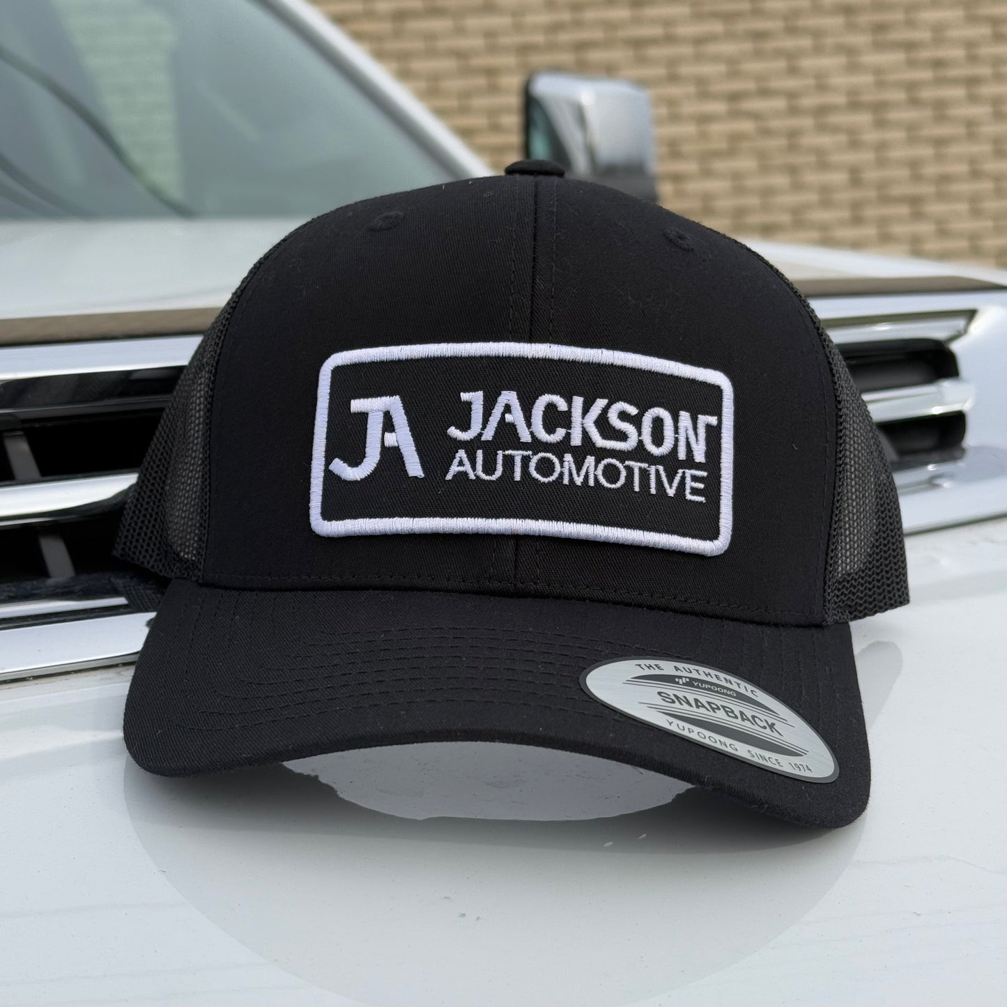 JA Embroidered Snapback Trucker Hat