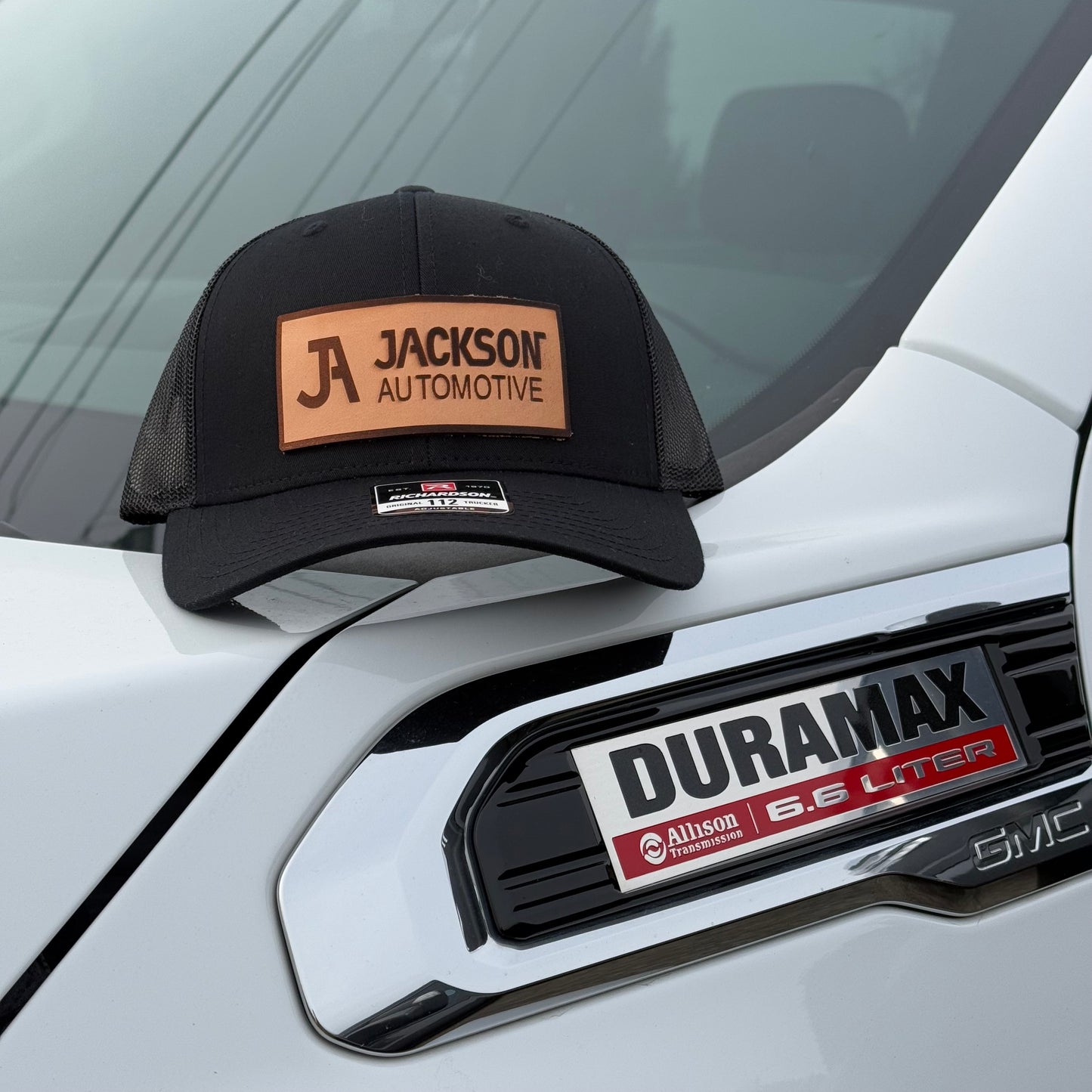 JA Leather Patch Snapback Trucker Hat