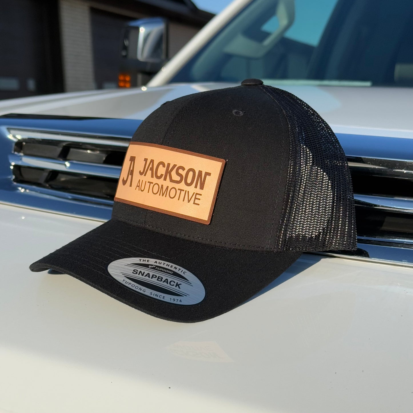 JA Leather Patch Snapback Trucker Hat