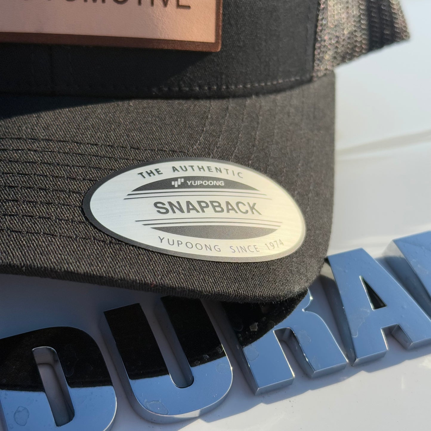 JA Leather Patch Snapback Trucker Hat